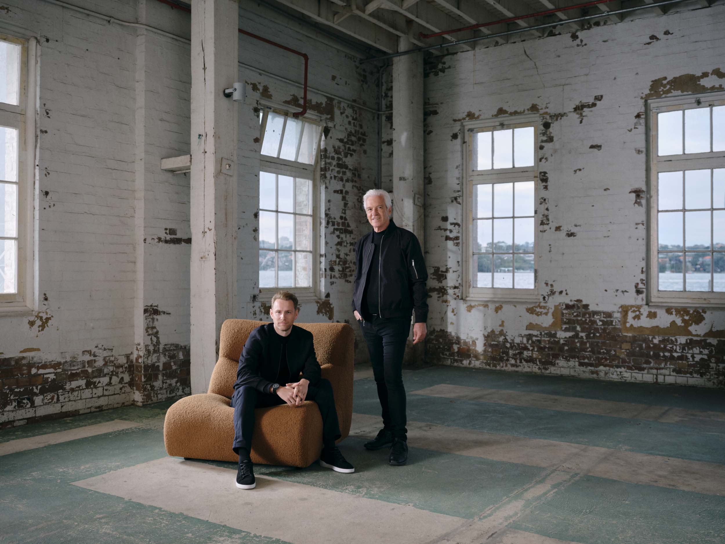 Shot of King Living’s head of design and founder together in a warehouse.